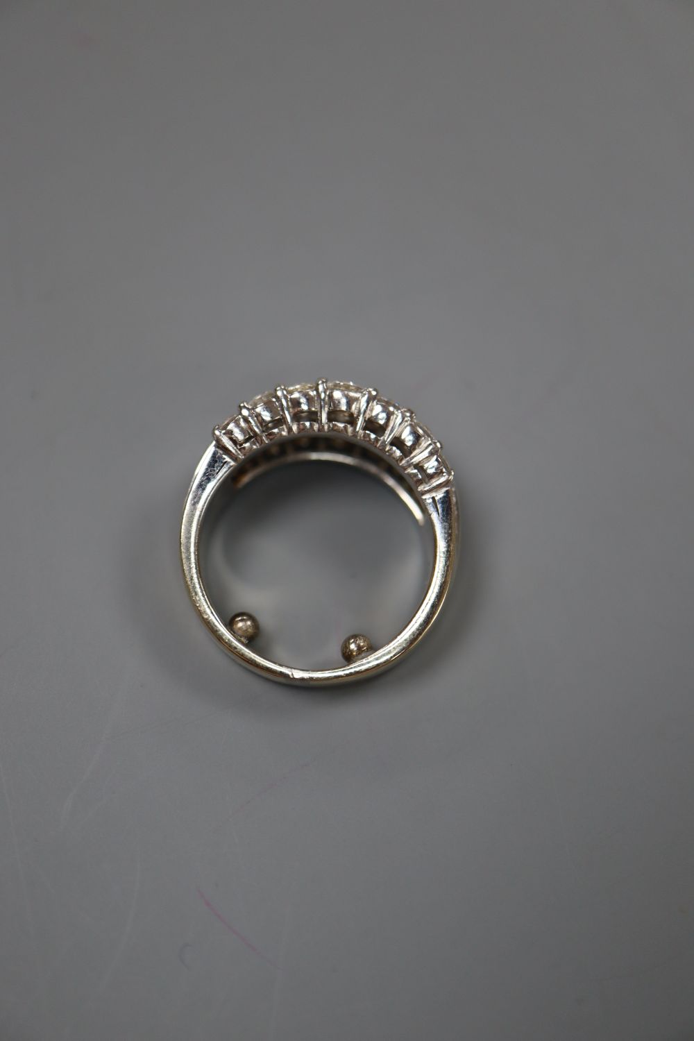 A modern 18ct white gold and three row baguette and round cut diamond set dress ring, by Picchiotti, size I/J, gross 10 grams.